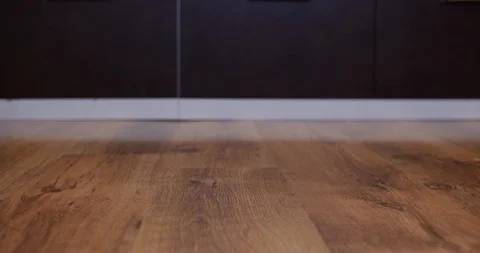 Robot vacuum cleaner is bringing back an empty glass Stock Footage 104960242