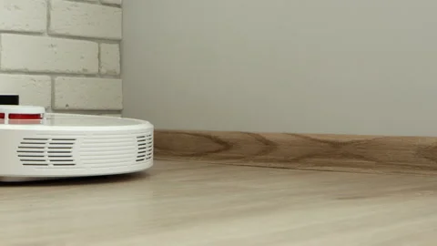 Robot vacuum cleaner from charging dock go cleaning, close-up Stock Footage 150888226