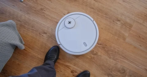 Robot Vacuum Cleaner Circles Obstacle Male Feet Stock Footage 105190669