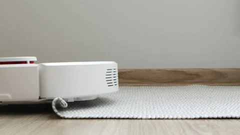 Robot vacuum cleaner cleaning and stuck, close-up. Technology cleaning Stock Footage 150887440