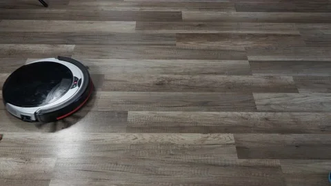 The robot vacuum cleaner is cleaning the apartment. modern technologies. Stock Footage 201440110