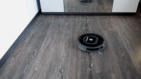 Robot vacuum cleaner is cleaning rotating in a spiral Stock Footage 108033056