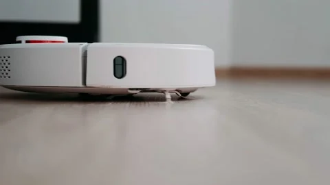 Robot vacuum cleaner cleans the floor. Housekeeping. Smart Home Video stock 165723954