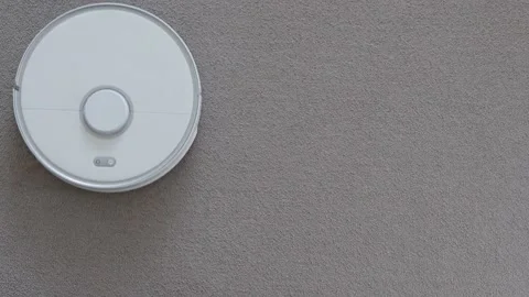Robot vacuum cleaner driving on carpet, top view Stock Footage 150216463