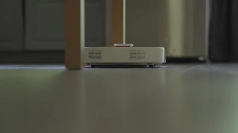 The Robot Vacuum Cleaner is made for modern kitchens, ensuring convenience and Stock Footage 308333343