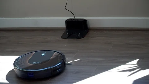 Robot Vacuum cleaner modern technology, returning to home charging station Stock Footage 113973823