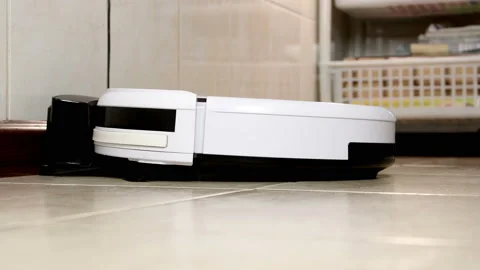 Robot vacuum cleaner moves down from the base of the charger Stock Footage 108656281