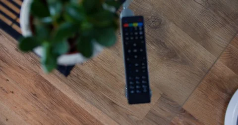 Robot vacuum cleaner passes under a glass table, top view Stock Footage 104960295