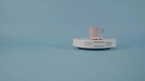 Robot vacuum cleaner serve coffe Stock Footage 229935220
