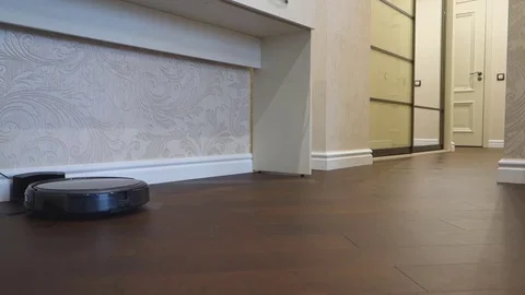 Robot vacuum cleaner start and cleaning Stock Footage 69781403