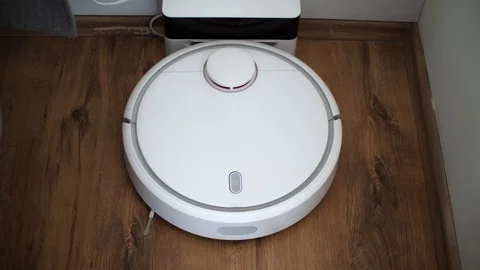 Robot vacuum cleaner start cleaning Stock Footage 104960334