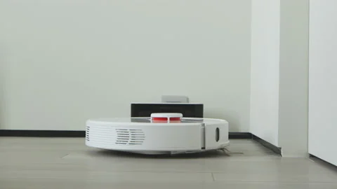 Robot vacuum cleaner start cleaning. Technology cleaning in modern interior Stock Footage 164229070