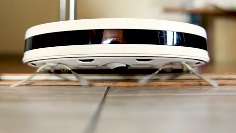 Robot vacuum cleaner stuck between the doorway in the bathroom, horizontal Stock Footage 242620919