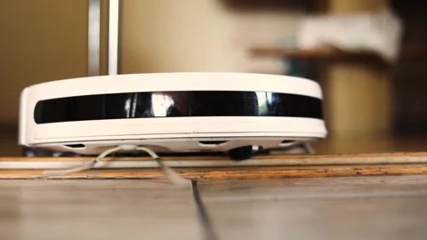 Robot vacuum cleaner stuck between a doorway, horizontal 스톡 동영상 242620923