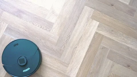 Robot vacuum cleaner vacuuming the floor in the bedroom. Smart home with automat Stock Footage 302374016