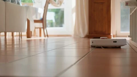 Robot Vacuum Cleaning a Home Video stock 345730894