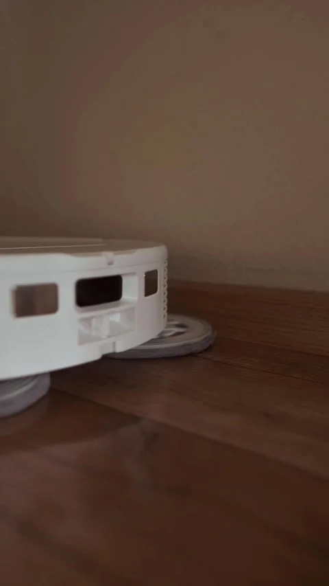 Robot vacuum cleans the floor automatic cleaning process without human Stock Footage 314642007