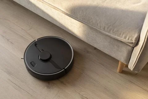 Robot vacuum doing its work house Stock Photos