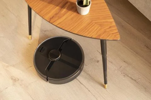 Robot vacuum doing its work house Stock Photos