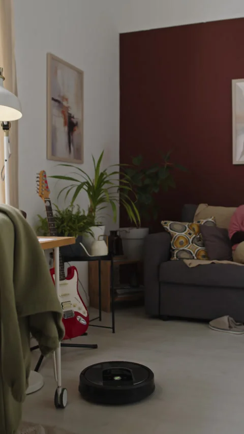 Robot Vacuum Helping Interracial Couple around House Stock Footage 258564437