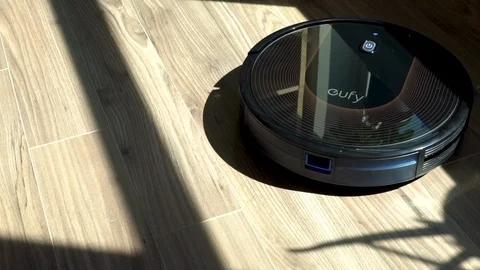 Robot Vacuum modern technology turning on and starting to clean apartment Stock Footage 113973723