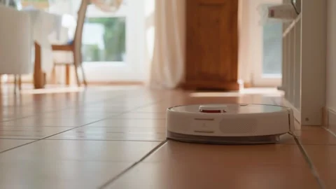Robot Vacuum Vacuums and Mops the Floor Stock-Footage 346057517