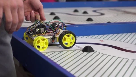 Robot on wheels constructed by programmers at a robotics competitions. Stock Footage 80946546
