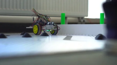 Robot on wheels constructed by programmers at a robotics competitions. Stock Footage 80951233