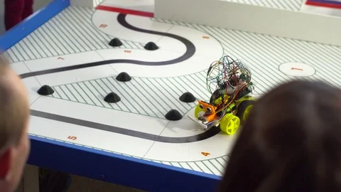 Robot on wheels constructed by programmers at a robotics competitions Video stock 80954701