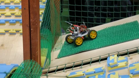 Robot on wheels constructed by programmers at a robotics competitions. Stock Footage 85552600