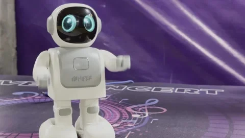 The robot is white and has a blue face Vídeo Stock 279823460