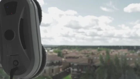 Robot window cleaner washes glass with round rags, device for cleaning window Stock Footage 220864582