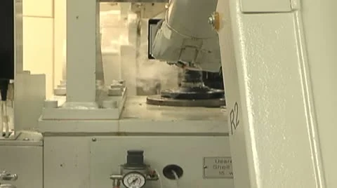 Robot working in a factory with liquid nitrogen Stock Footage 13027010