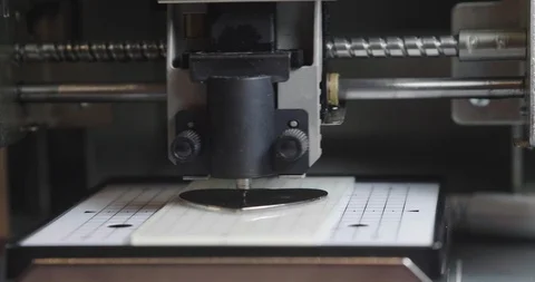 A robotic and automated 3D printer produces the form imposed by the computer. Stock Footage 115129206