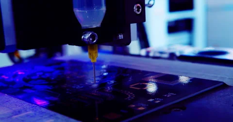 Robotic arm applying solder paste on a PCB. Macro close-up Stock Footage 336556482