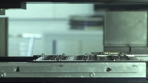 Robotic arm assembling electronic components parts on circuit board close up Stock Footage 248833639