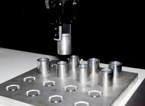 Robotic arm clamp sample and transfer in metal plate Stock Photos
