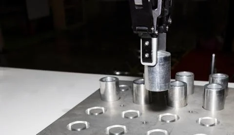 Robotic arm clamp sample and transfer in metal plate Stock Photos