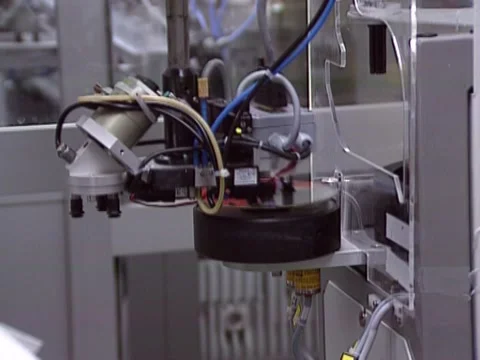 Robotic arm - compact disc cd dvd manufacturing 1980s Stock Footage 153977546