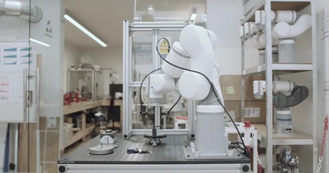 Robotic arm doing repetitive task Stock Footage 121683043