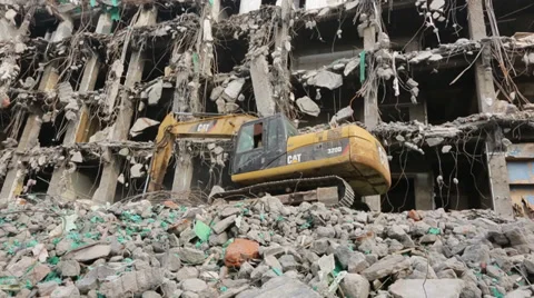Robotic arm of a large machine demolishing a city building Stock Footage 35364385