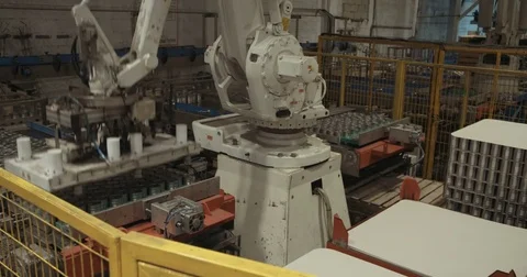 Robotic arm loading cans in a large industrial food warehouse Stock Footage 78037305