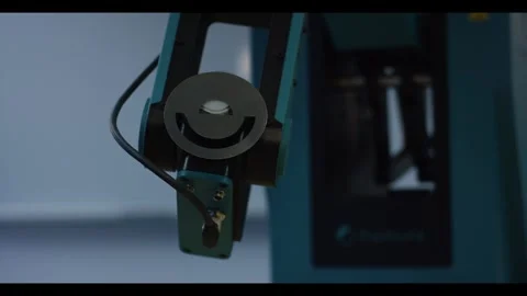 Robotic Arm Lowering Vacuum Suction Gripper Toward Table Sample, Low Angle Stock-Footage 341298451