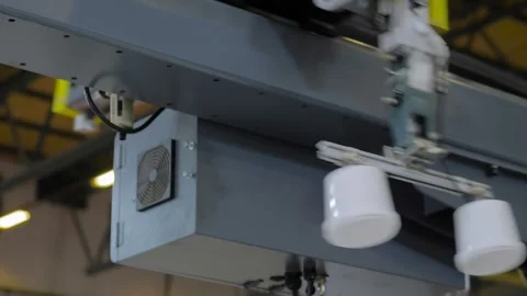 Robotic arm manipulator with suction cups moves plastic containers: close up Stock Footage 337061504