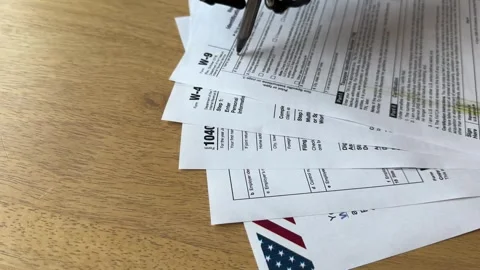 Robotic Arm Over Tax Forms Stock Footage 265310108