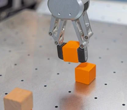 Robotic Arm Picking Cube Stock Photos