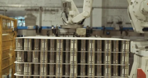 Robotic arm placing cans for packaging in a warehouse Stock Footage 78037882