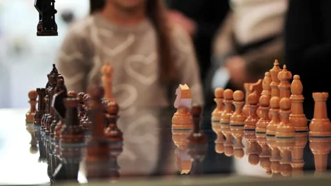 Robotic arm playing chess against a girl Stock Footage 304032555