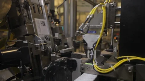 Robotic arm sorting pill bottles. Being put with documents B Stock Footage 102186368