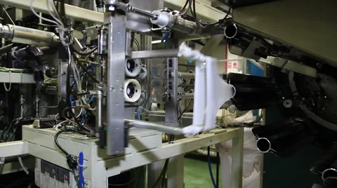 Robotic Arm Working on Factory Assembly Line - Pantyhose Manufacturing Stock Footage 59671800